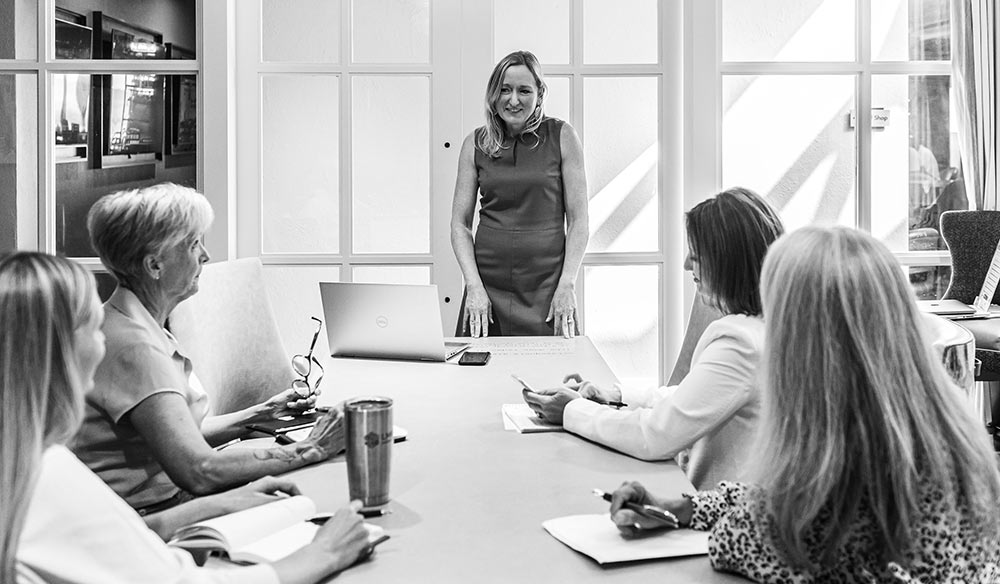 Laura Bunte, President, meets with members of the LMBA Marketing Team